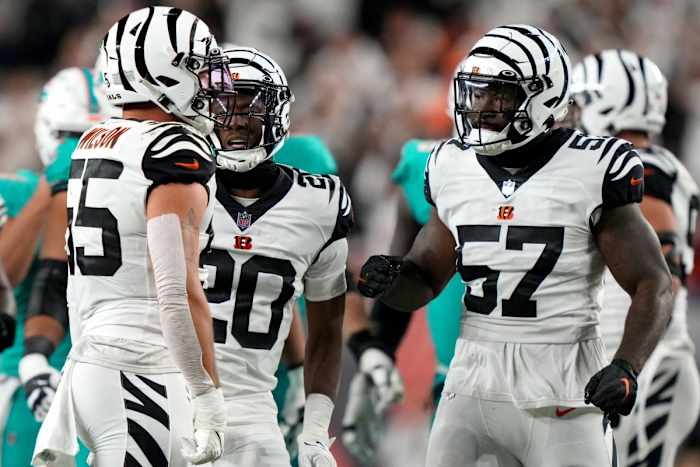 Sep 29, 2022; Cincinnati, Ohio, USA; Cincinnati Bengals linebacker Germaine Pratt (57) and cornerback Eli Apple (20) congratulate linebacker Logan Wilson (55) on a tackle for loss in the third quarter against the Miami Dolphins at Paycor Stadium in Cincinnati. The Cincinnati Bengals won, 27-15 to improve to 2-2 on the season. Mandatory Credit: Kareem Elgazzar-USA TODAY Sports